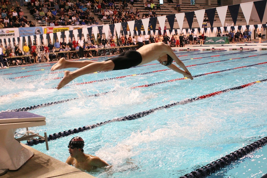 Kasey Calwell glides over John Utas.
