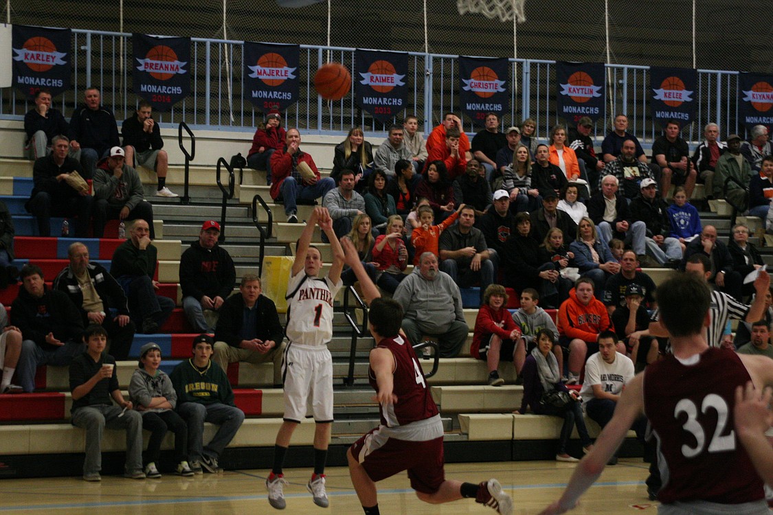 Michael McElroy takes aim from long range.