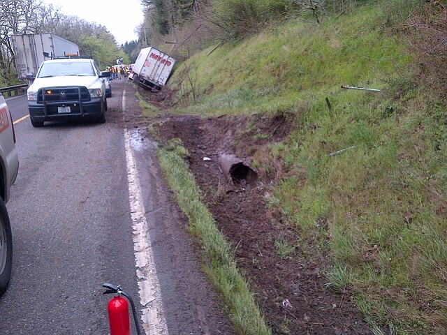 The truck traveled about 300 feet through this ditch before taking out the telephone pole and releasing a live wire. "People said sparks were flying all over the place," said Washington State Trooper Will Finn. "It sounded pretty dramatic."