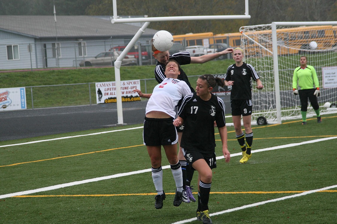 Camas High School senior Raya Klein takes on two defenders from Bonney Lake Nov. 13, at Doc Harris Stadium.