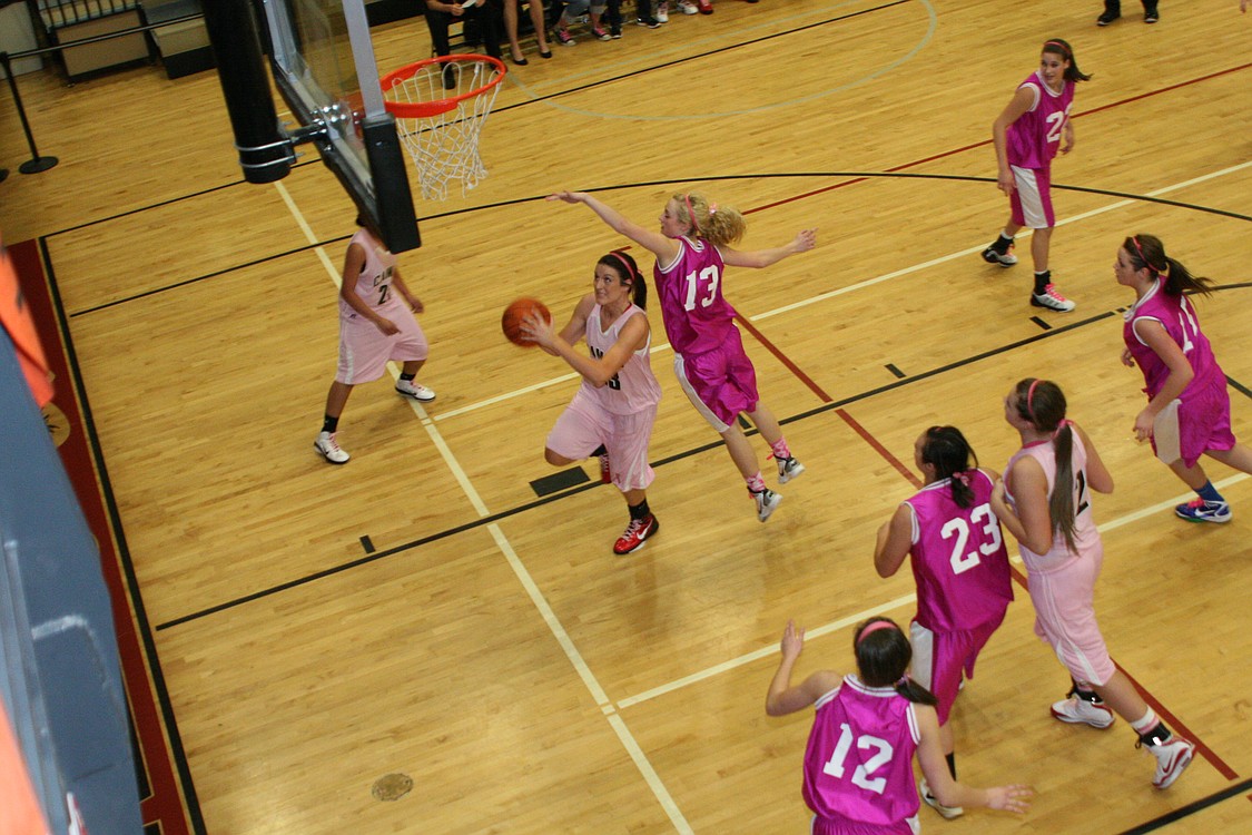 Kayla Roche rolls to the hoop for two.
