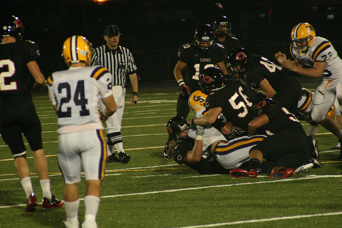 Odin Coe wraps up a Columbia River ball handler with help from Erik Clay, Ikaika Gunderson and Alex Hows, and encouragement from Brent Hill, Damon Kosaki and Addison Owen.