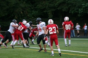 Caleb Howard glides into the end zone with the help of his Washougal teammates Friday, at Kiggins Bowl. The senior scored a touchdown, recovered a fumble and snagged an interception to help the Panthers win 41-28. It's the first time Washougal beat Fort Vancouver in football since 1988.