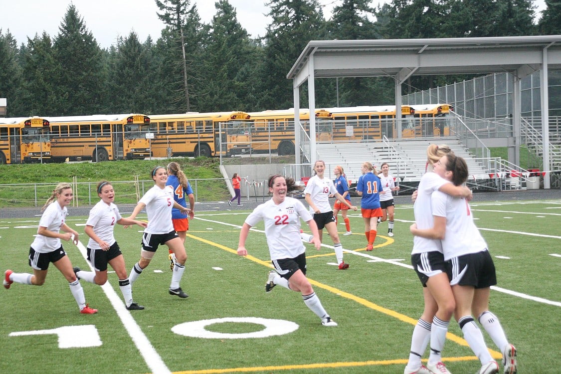 The Camas High School girls soccer players celebrate the goal that propelled them to the state tournament Nov. 5, at Doc Harris Stadium.