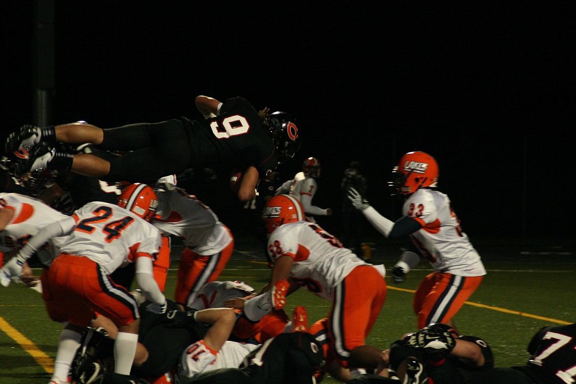 Addison Owen goes over the top to score a huge touchdown for the Papermaker football team Nov. 19, at Doc Harris Stadium.