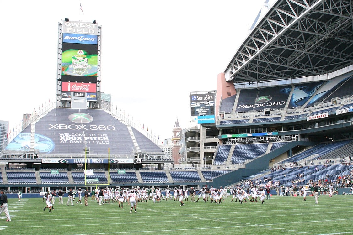 The Camas High School football players and coaches get pumped for the opening kickoff of the Emerald City Classic game with Timberline, Sept. 4, at Qwest Field.