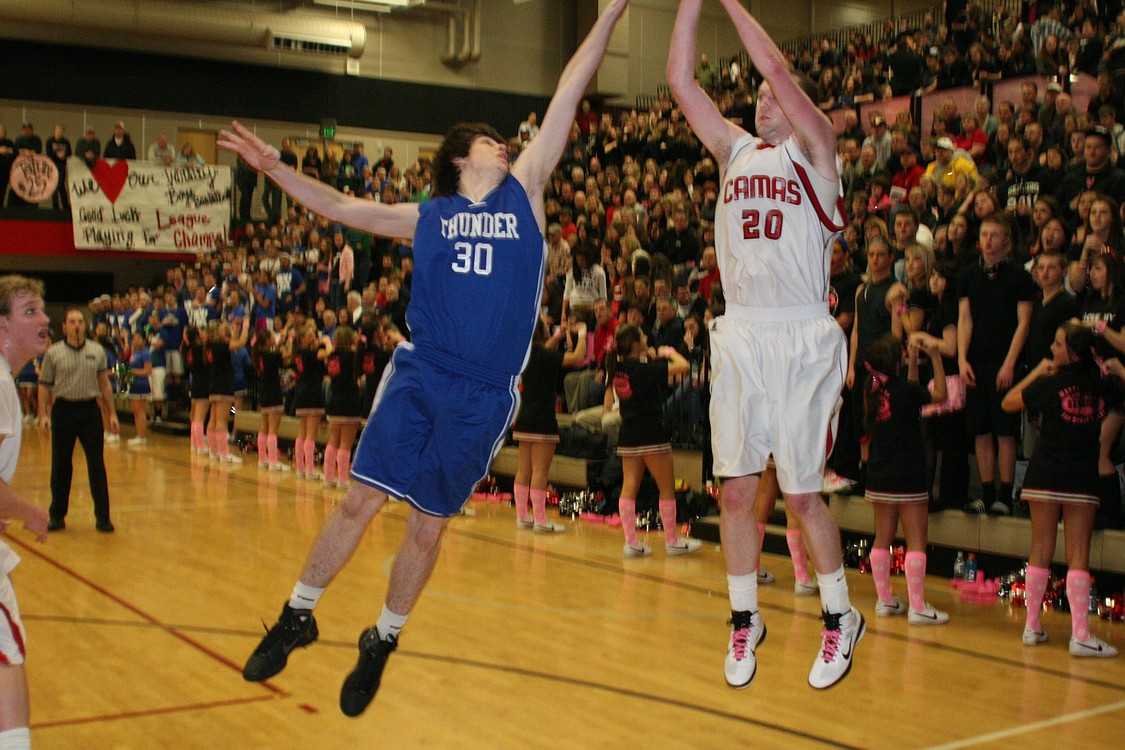 Marc Eppinger makes a 3-pointer.