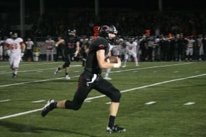 Cooper McNatt picks off a pass in open space and returns it for a touchdown Friday, at Doc Harris Stadium. This was one of five interceptions that helped the Camas football team beat Battle Ground 42-6.