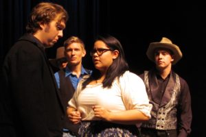 Petruchio (Tristan Fackler) and Senora Baptista argue while Lucentio (Carson Connors) and Gremio (Corbin Jones) look on in amazement.