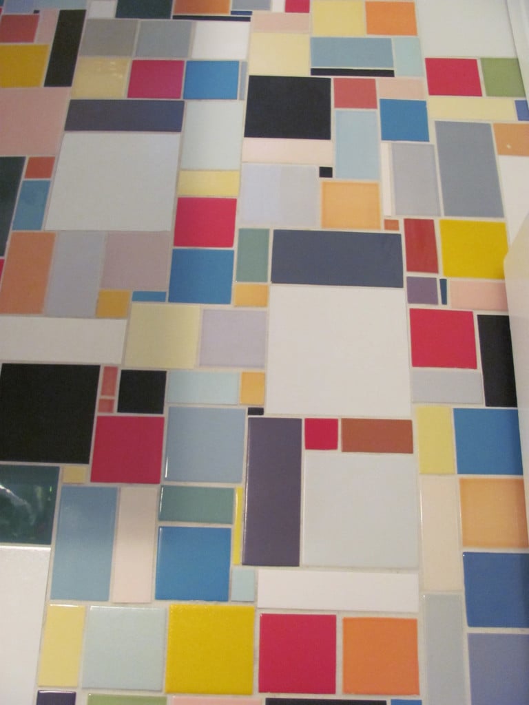 This powder bath floor is made up of collected salvaged tiles. 