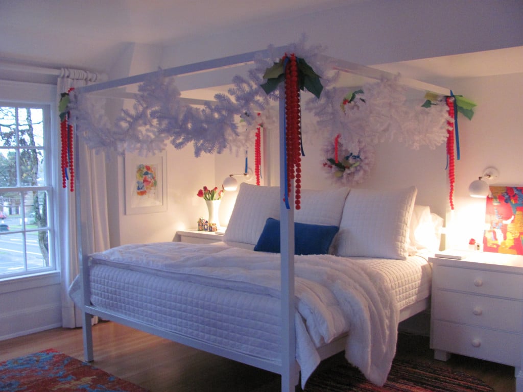 The master bedroom includes red oak hardwood, original double hung windows and a new master bathroom and closet. 