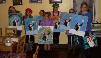 Young participants show off their creations after a 