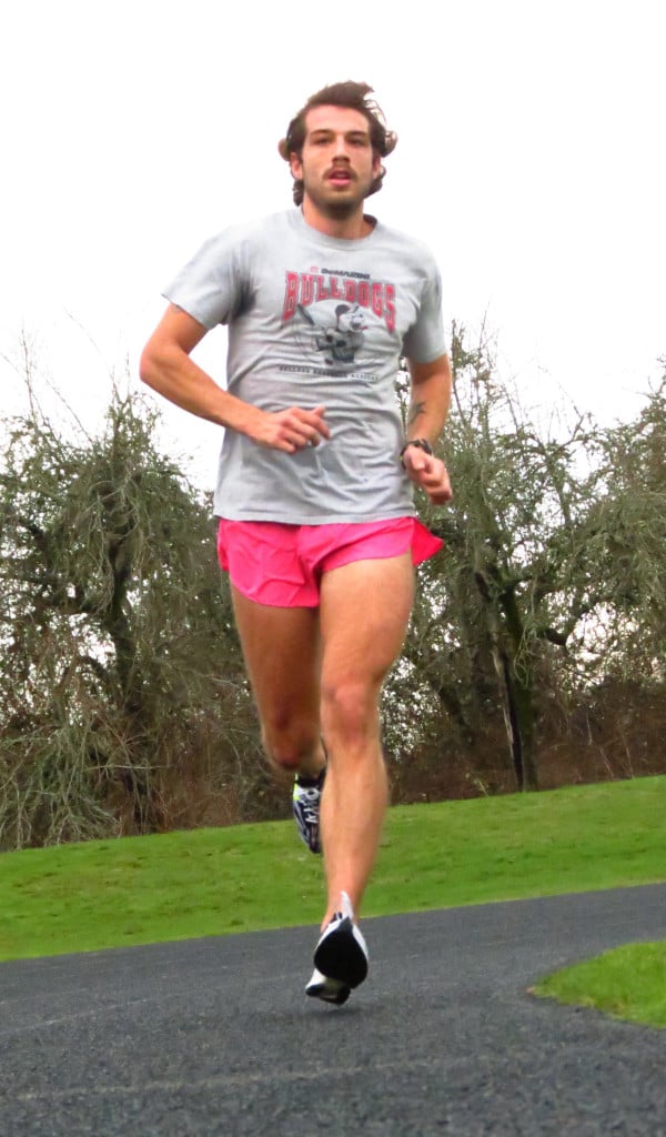 Back home in Camas for the holidays, Spencer Head goes for a training run at Skyridge Middle School under the watchful eye of his former high school coach Sherrie Geiger. Head won the 800-meter state championship for the Papermakers in 2008. Seven years have passed, but he still goes to Geiger for advice.