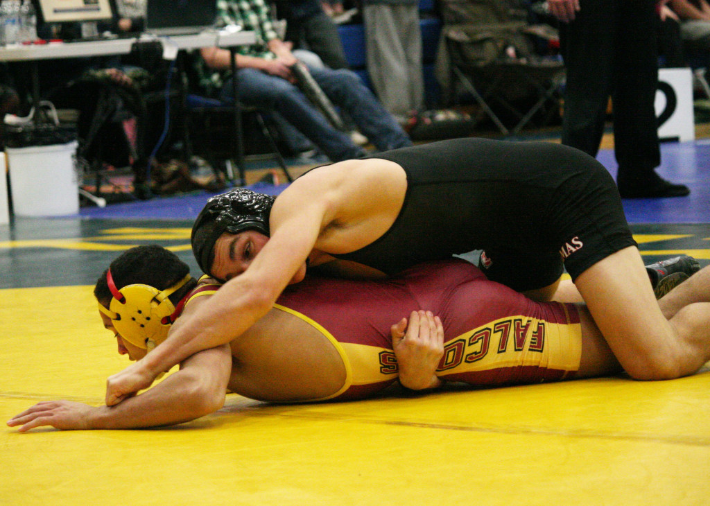 Camas wrestler Rylan Thompson keeps Prairie's Kodi Walls on the mat during his 132-pound semifinal match at the Pacific Coast Championships Saturday, at Mountain View High School. Thompson won 5-3 to reach the championship round and finish in second place.