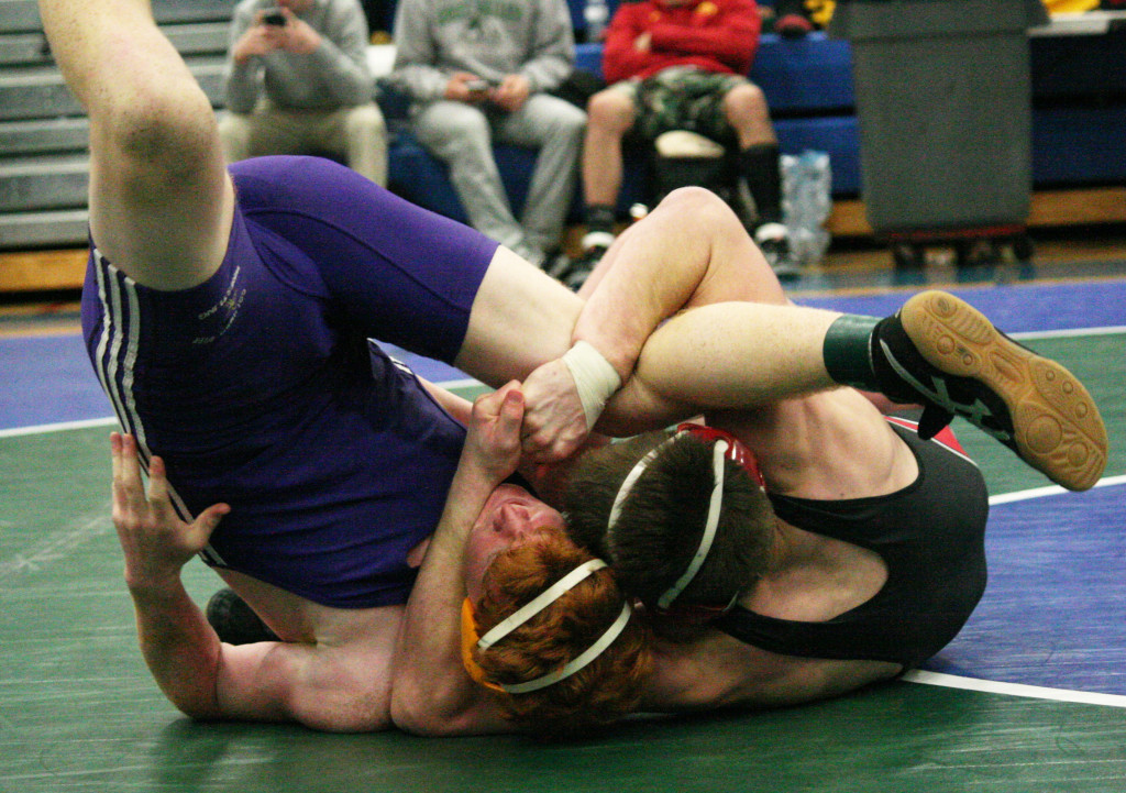 Sam Malychewski (right) locks up another victory for the Camas wrestling team. The sophomore captured the 170-pound Clark County championship Saturday. (Dan Trujillo/Post-Record)
