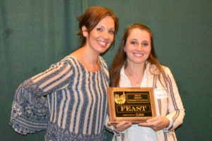 Brianne Johnson, marketing director for DeWils, recently gave the "Best Presentation" award to Melissa McCusker, co-owner of Feast at 316 and Miss Nola's Cafe, in Camas. McCusker and her husband, Tim, also received the "Best Overall" award for their participation in "Chef, Hop & Vine," at the NW Natural New Homes Tour in Camas and East Vancouver. (Photo contributed by Building Industry Association of Clark County)
