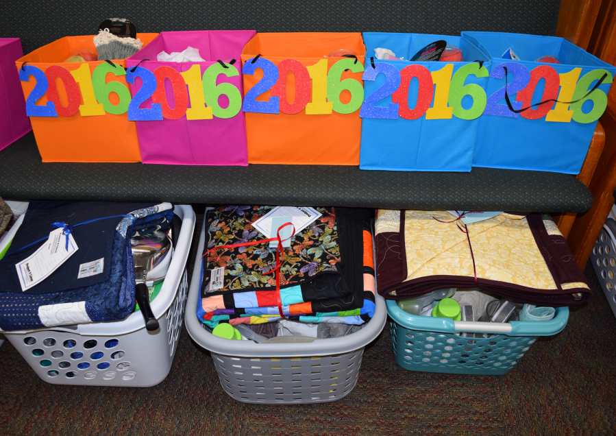 Graduation baskets are filled with towels, dishes, silverware, can openers, tool kits, wall clocks, pillowcases, cookware, laundry soap, scented candles, dry foods and cans of soup. (Contributed photo)