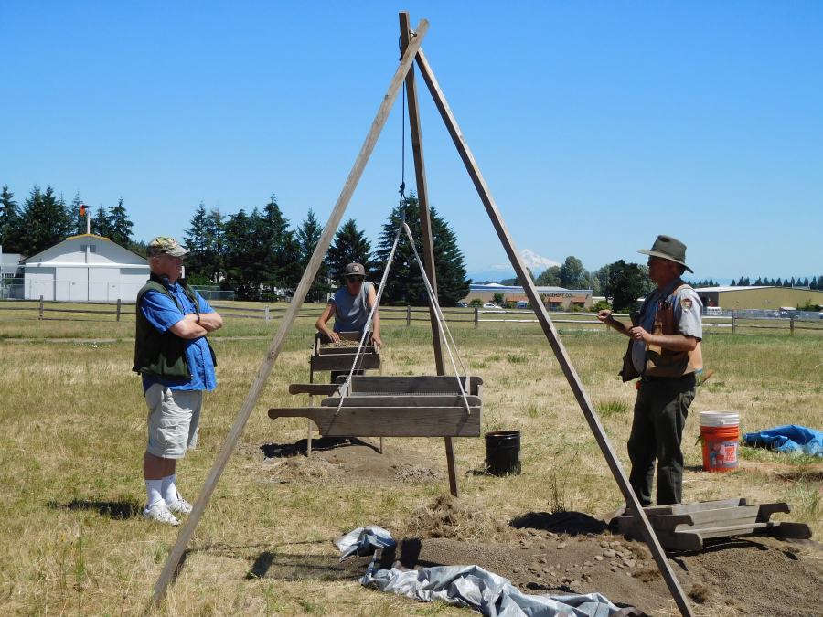Doug Wilson, a National Park Service archeologist, chats with a visitor at the Public Archeology Field School.