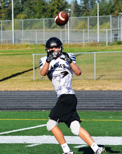 Camas High School senior Michael Matthews keeps his eye on the football. The Papermakers host Central Catholic, of Portland, Oregon for the first game of the season Friday, Sept. 2, at 7:30 p.m., at Doc Harris Stadium.