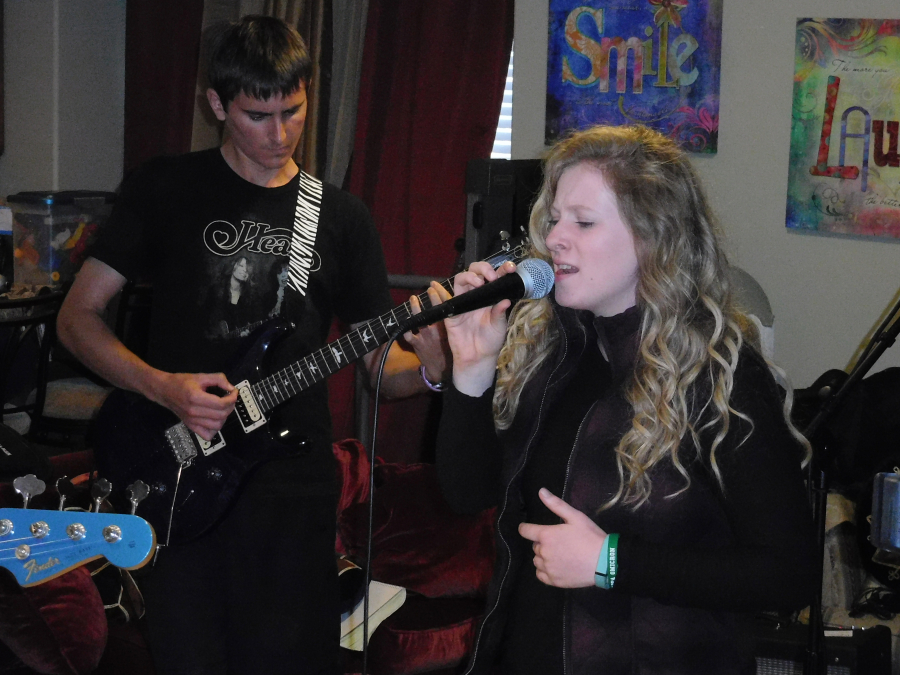 Zephry Lyne and Rachel Higgins harmonize during a recent practice.