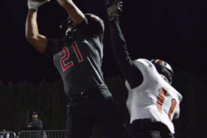 Drake Owen comes down with the first of his three touchdowns to help the Camas football team defeat Battle Ground 49-28 Friday, at Doc Harris Stadium.