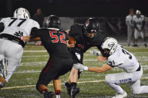Jack Colletto bowls over the defender from Skyview and keeps running Friday, at Doc Harris Stadium. The Papermakers defeated the Storm 31-9. Colletto rushed for 139 yards and three touchdowns. He also threw for 110 yards and a touchdown. 