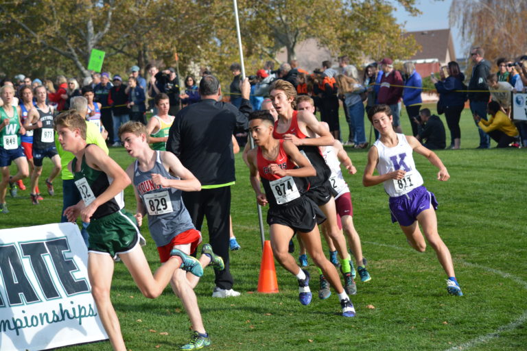 Yacine Guermali and Daniel Maton stick together for the Papermakers through the first mile of the 4A boys state championship race.