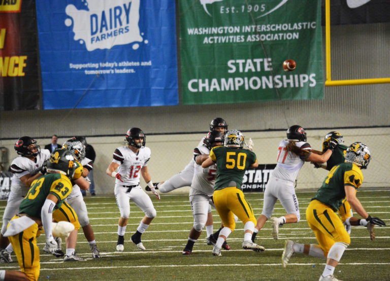 The Camas offensive linemen protect quarterback Jack Colletto.
