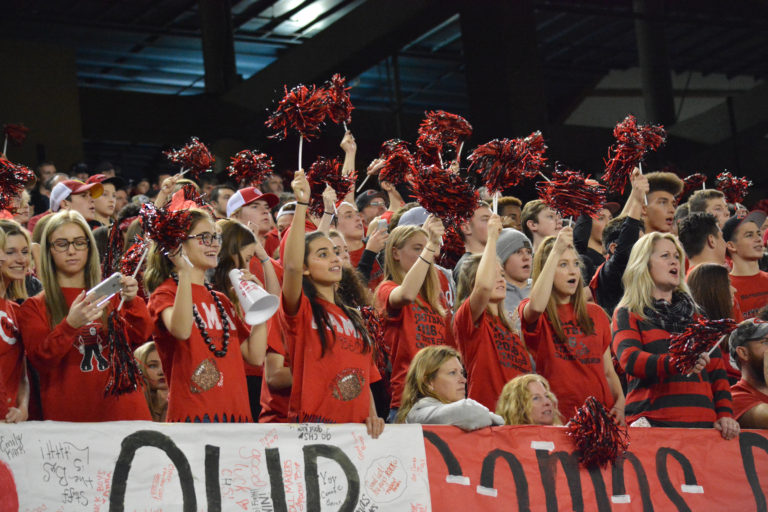 Fans in the crowd keep the Papermaker football players pumped up during the state championship game at the Tacoma Dome.