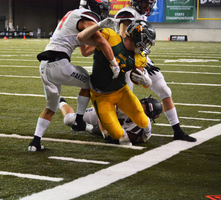 David Aarhus grabs the Bomber's legs, and Sedric Ruiter and Cooper McNatt diffuse the situation on fourth down and inches.