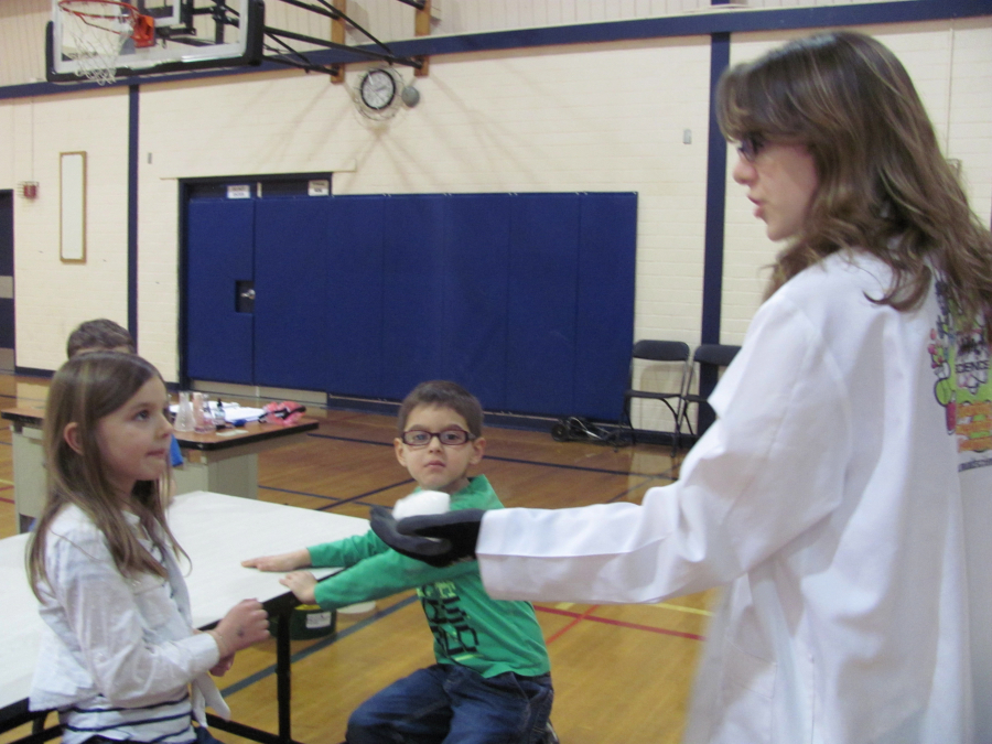 Students take a closer look at the dry ice during a community education "Mad Science," class. (Post-Record file photos)