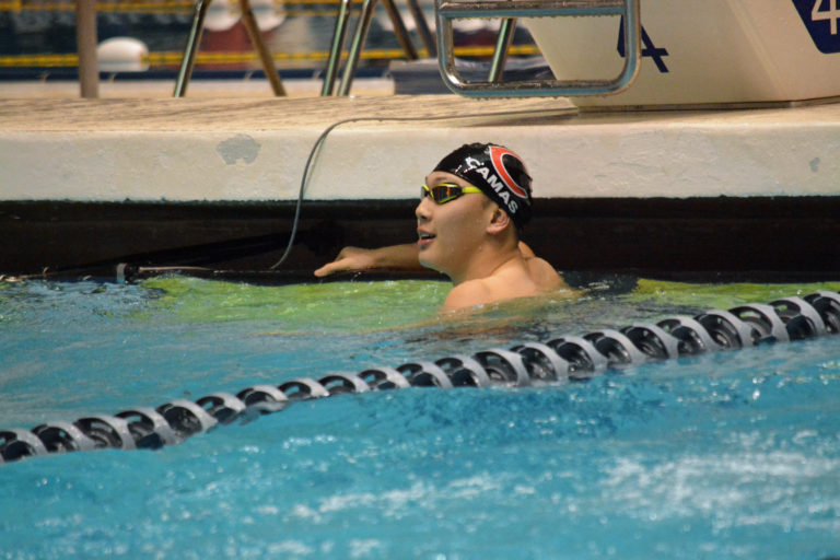 Mark Kim gets the state meet started off right by winning the 200 freestyle championship for the Papermakers.