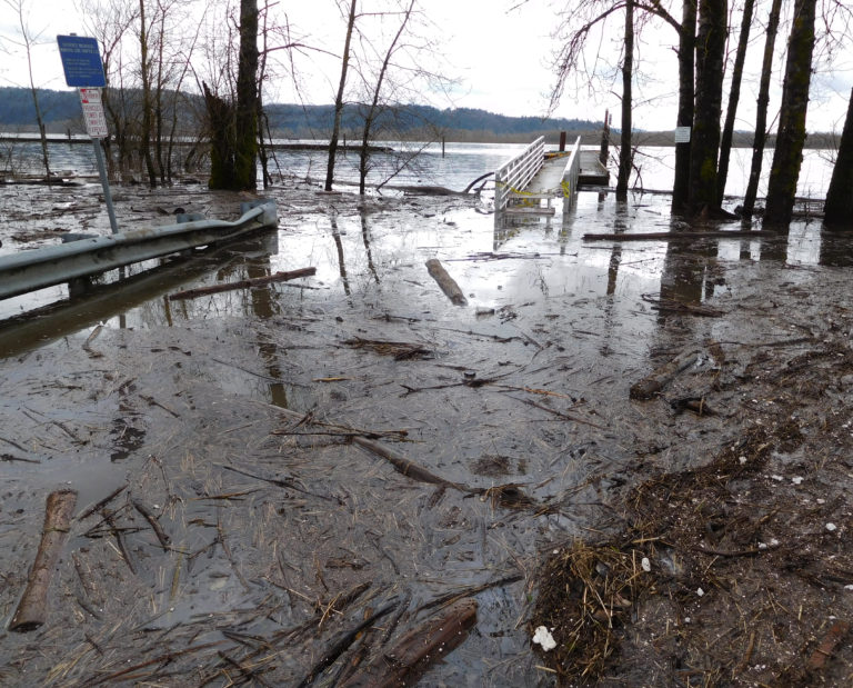 Water rises over the parking lot at Steamboat Landing.