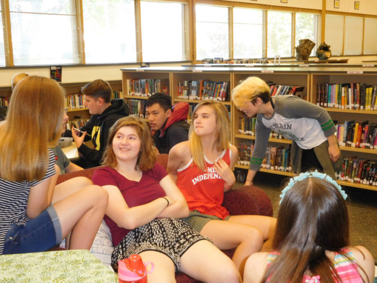 Students in Emily Crawford&#039;s journalism class at Liberty Middle School discuss story ideas for an upcoming edition of  the paper. Everyone contributes, notes Crawford.