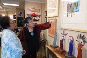 Pitt discusses her "Pipestone Dreams," lithograph, which is part of her June exhibit at the Camas Gallery. Lithographs are copies of an original work created by an artist. They're different from monotypes and monoprints in that a lithograph is actually drawn by the artist and not etched. Typically, they are sold in limited editions.
