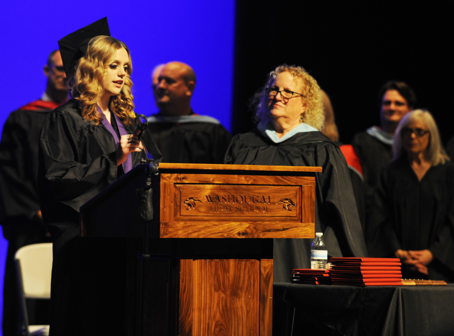 Carol Boyden, retiring principal of Exselsior High School, looks on as Arieanna Divine thanks her and other staff members for providing a supportive school environment. 