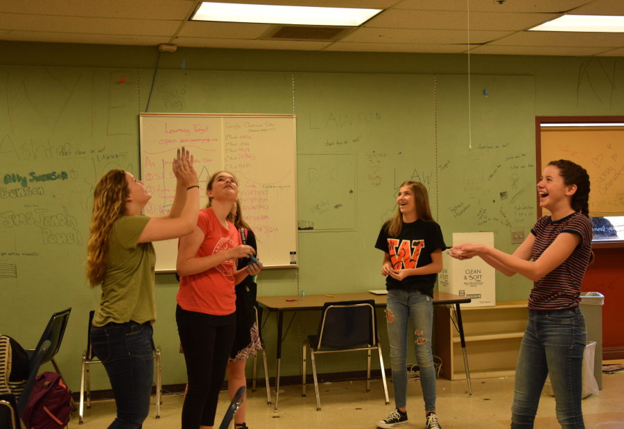 Science students play with their self-made "slime" by watching it droop from the ceiling at Jemtegaard on June 22, 2017. The students of Glenn Rhodes used various ingredients to create types of silly putty that ranged from slime to rubbery solids. (Photo by Tori Benavente/Post-Record)