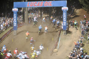 Riders from around the world head up Horsepower Hill, while fans stand on the slopes and lean on the fences to get a closer look at the action, during the ninth round of the of the Lucas Oil Pro Motocross Championship, Saturday, at Washougal Motocross Park.