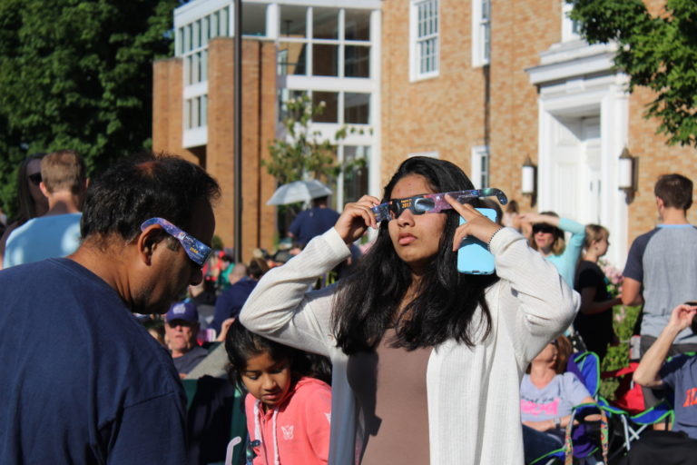 Eclipse watchers gather in front of the Camas Library Monday morning to view the historic solar eclipse on Aug. 21. Photo by Kelly Moyer/Post-Record