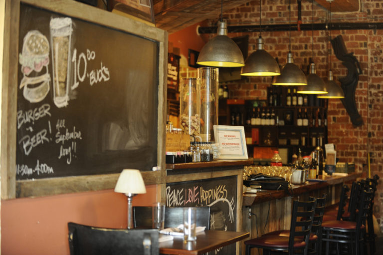 The decor at Feast 316 includes a wine shelf, stained and burnt at Lutz Hardware, to create an antique look. It also consists of wine boxes from the former Camas Liquor store. Various artifacts are on loan from the Georgia-Pacific paper mill in Camas.