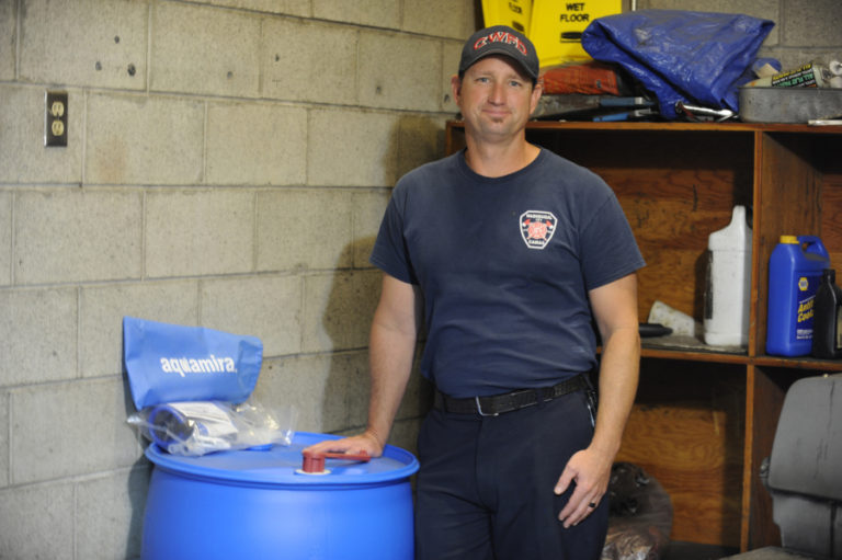 Camas-Washougal Fire Department Captain Michael Brown, standing next to an emergency water barrel with pumps and filters, has taken on the role of natural disaster coordinator for the CWFD. "I have been working hard to get the department prepared for the Cascadia earthquake and any other large scale natural disasters that may come our way," Brown said.
