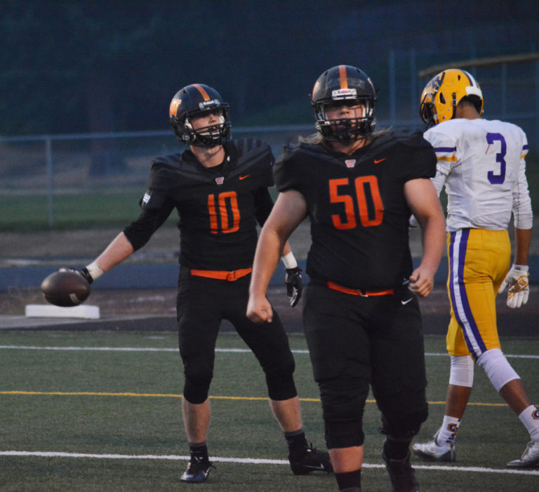 Nathan Tofell (10) tosses the football back to the official after scoring a touchdown for the Panthers Friday.