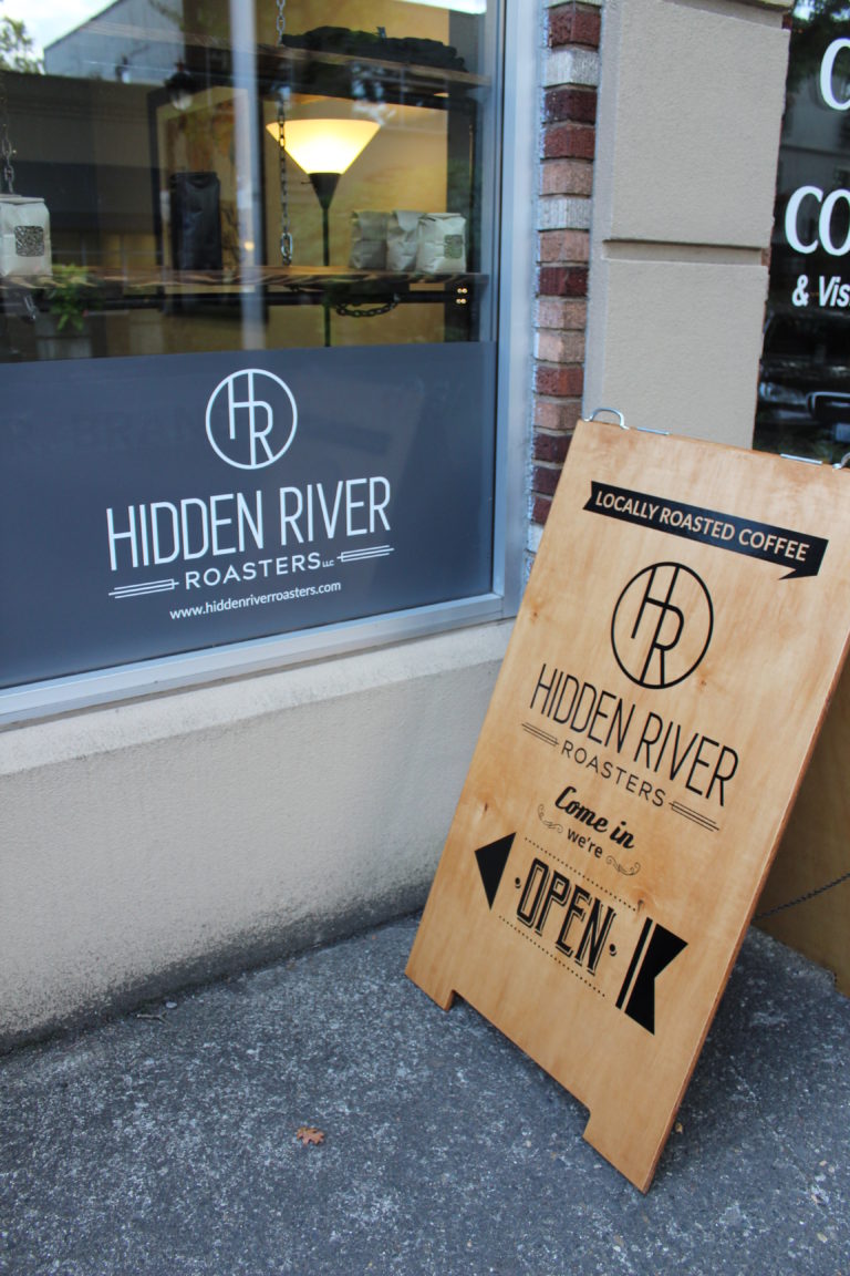 Dr. Brandon Pasa, a co-founder of East Clark County’s first coffee roastery, Hidden River Roasters, advertises the roasting company at his Columbia Chiropractic & Massage business on Fourth Avenue in historic downtown Camas. Pasa and his business partner, Aaron Baldwin, a Camas native, will soon open the Hidden River Roasters cafe with on-site roastery at the former B&B Fish Market at 536 N.E. Fifth Ave., Camas.