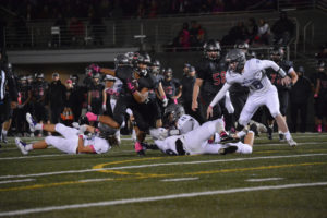 Drake Owen shakes off three Timberwolves and scores a 28-yard touchdown for the Papermakers Oct. 12, at Doc Harris Stadium. Camas defeated Heritage 63-13 to improve to 7-0 on the season. 