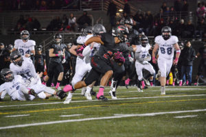 Drake Owen runs circles around the Timberwolves Thursday, at Doc Harris Stadium. The Camas High School senior scored three touchdowns to help the Papermakers defeat Heritage 63-13.