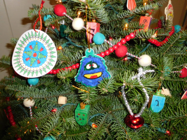 Local Girl Scouts created handmade ornaments, celebrating Christmas, Hanukah, Kwanzaa, Winter Solstice and Pagan traditions, for a tabletop tree in the Washougal Festival of Trees.