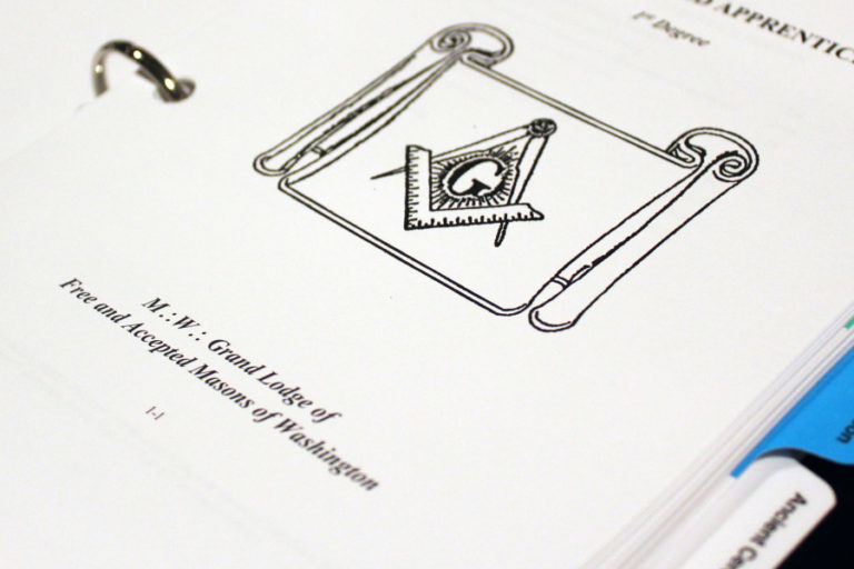 Symbols are a big part of the freemasons&#039; world. Pictured here, inside a book kept at the Washougal-based masonic lodge, is the &quot;G&quot; surrounded by a compass and square. The &quot;G&quot; signifies either God or Geometry (the basis of freemasonry), depending on which freemason you ask.