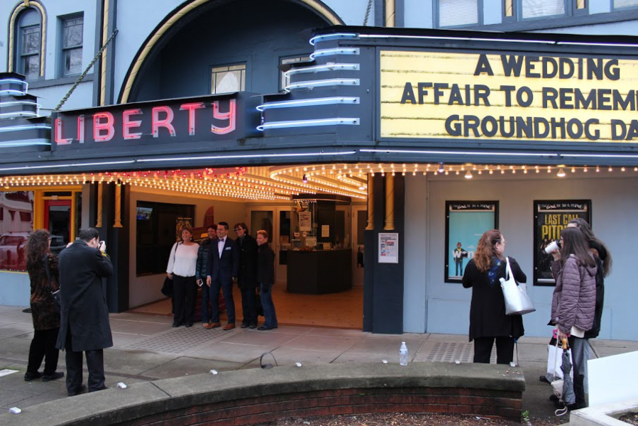 Nick Calais poses with family members in front of Liberty Theatre before his wedding to Tami Weidert. The couple said they were grateful to be married at Liberty, a central point of downtown. 