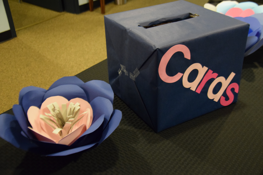 Paper flowers keep to the wedding's Camas theme.