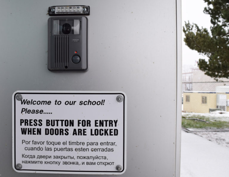 The video and intercom system at the back entrance of Odyssey Middle School, pictured here, allows people to ring the buzzer and then talk and be seen by staff before entering the building.
